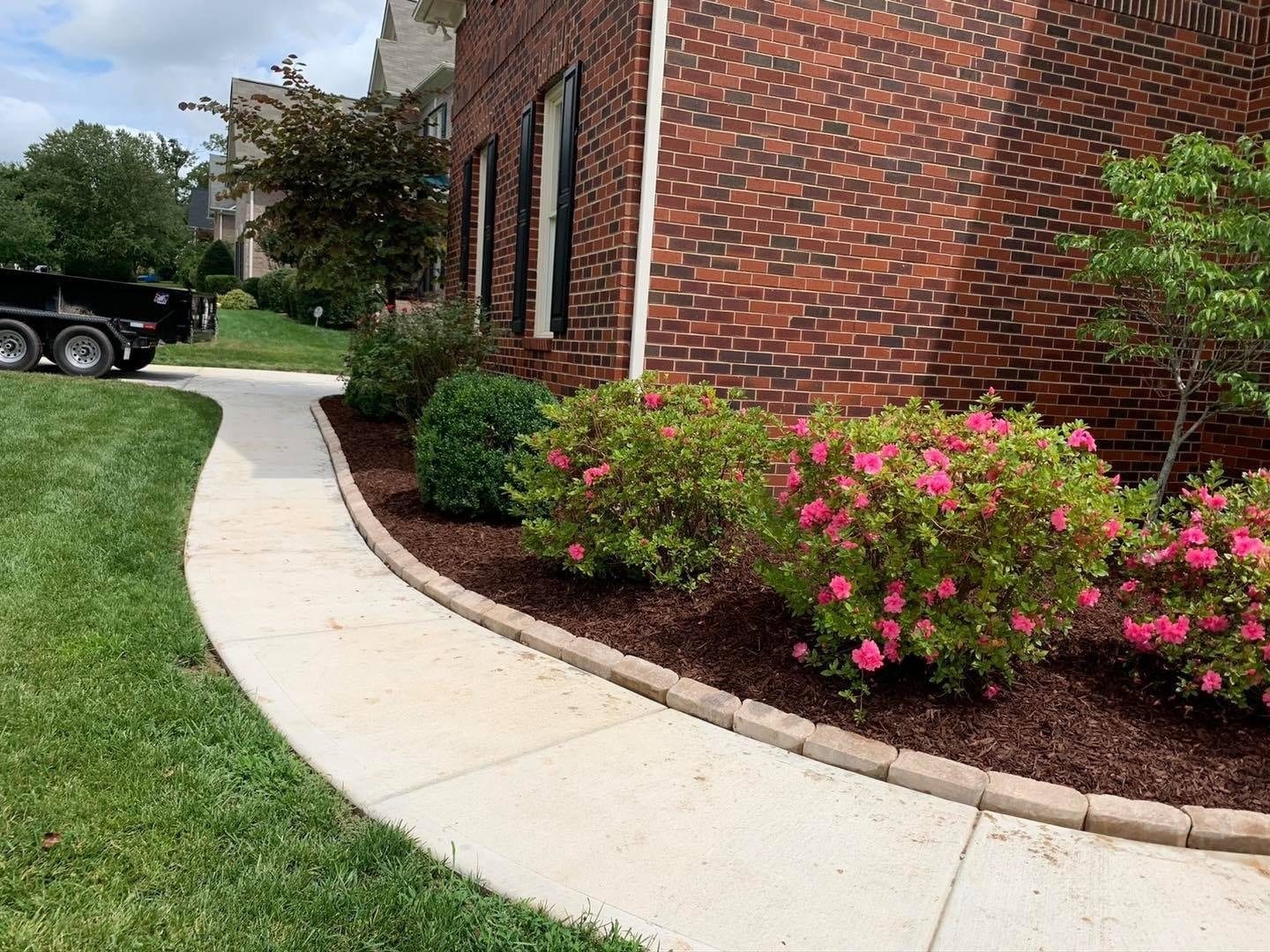Plantings set along a walkway