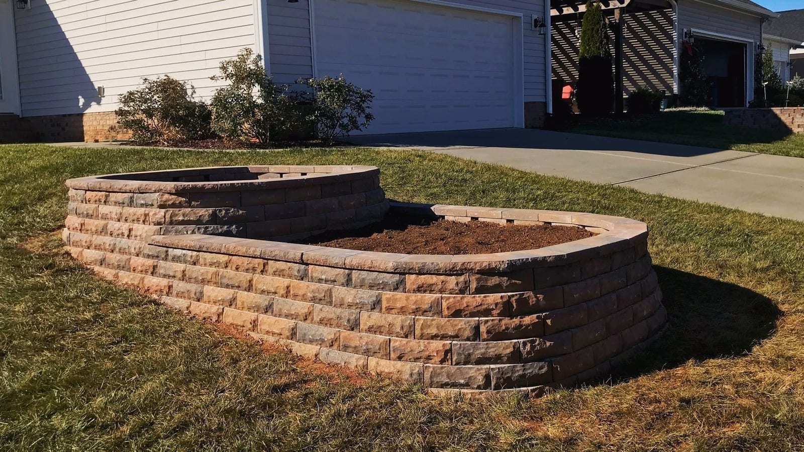 Curved wall forming a raised planter